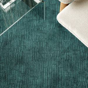 Object Carpet Slate Teppichboden in einer Lounge mit dezent linear strukturierter Oberfläche