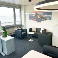 Lounge- und Empfangsbereich von ABZ-SUiSSE mit moderner Schäfer Shop Einrichtung