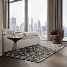 Object Carpet Rebell Teppich in einem Wohnbereich mit urbanem, rasterartigem Muster